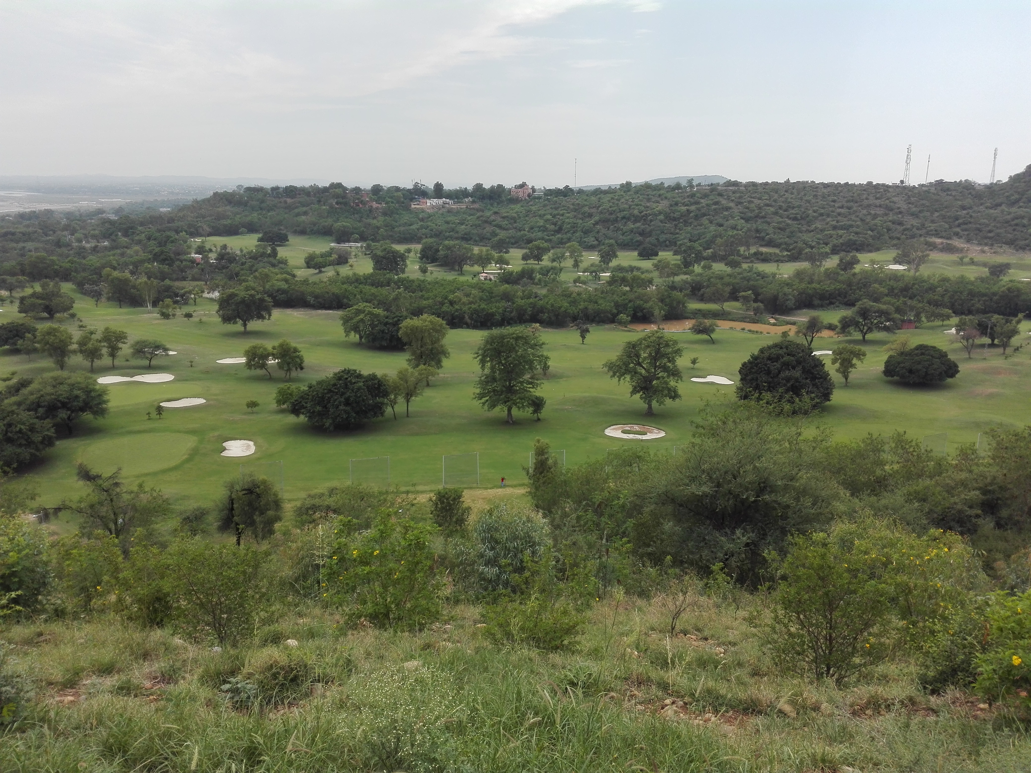 Golf range image representing Topgolf work